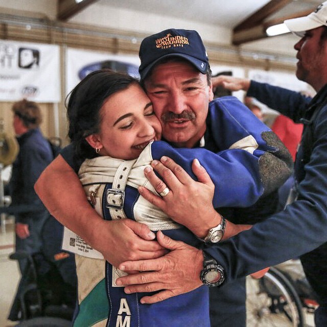@MilTimesPhoto: Fleet Master Chief Marco Ramirez hugs 's Sadie Strong after she won prone rifle at