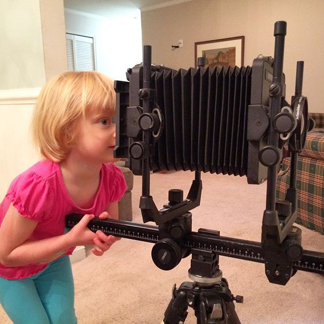 Mary inspects the 4x5.