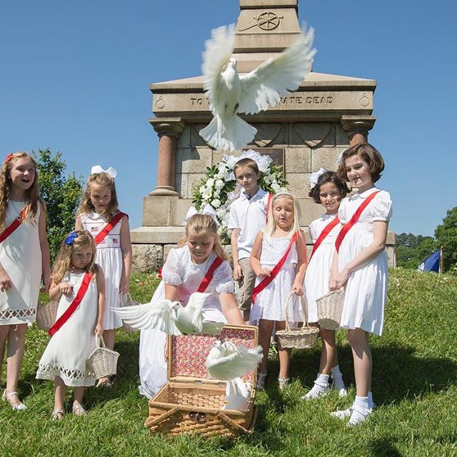 Children release doves at the Ladies' Memorial Association's 151st Memorial Day Observance at the Fredericksburg Confederate Cemetery in Fredericksburg, Va. on May 29, 2017. (Mike Morones/The Free Lance-Star)